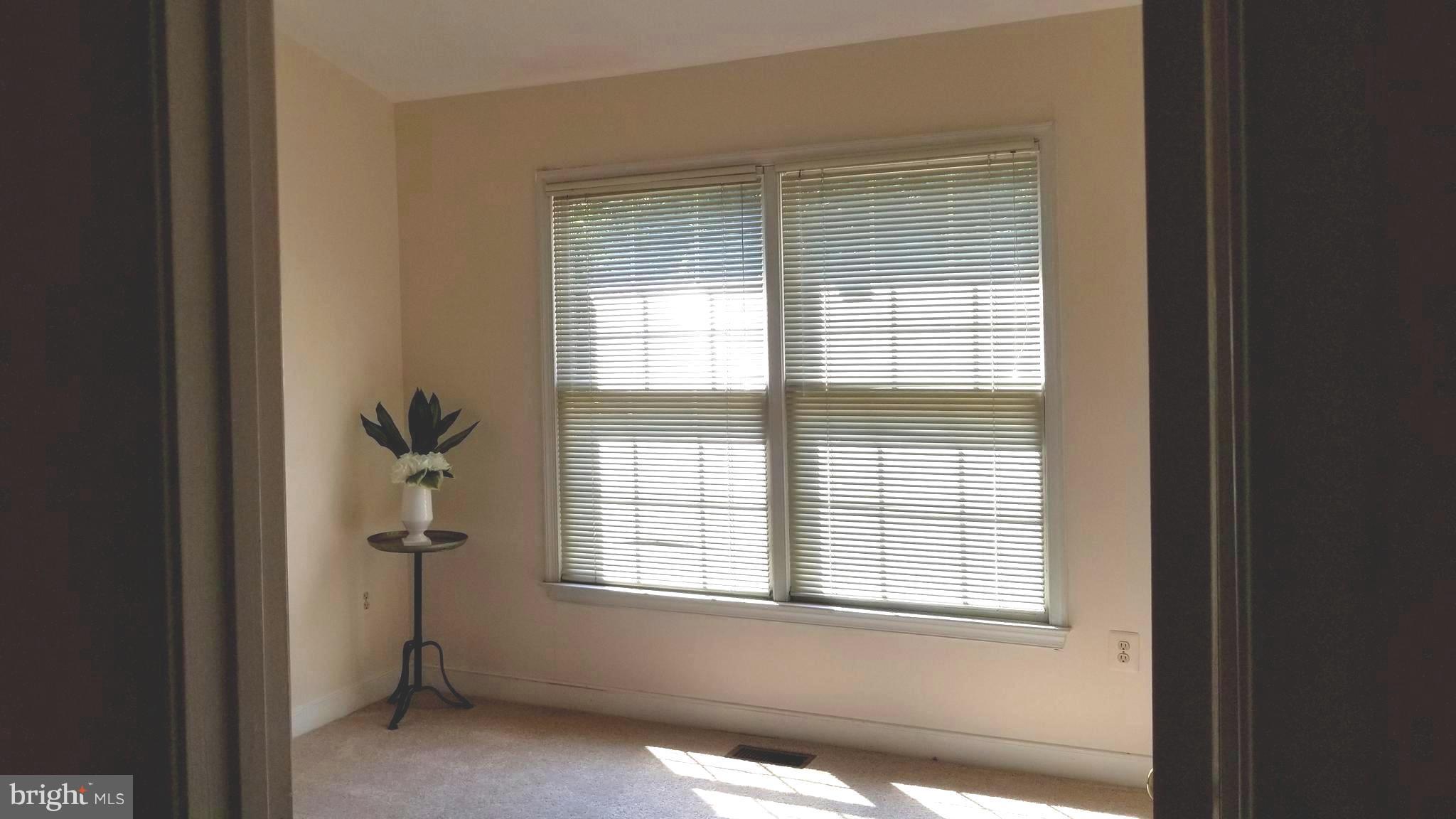 10955 Rocky Mt Way Silver Spring, MD 20902 - Photo 24 of 30 a view of an empty room with a window