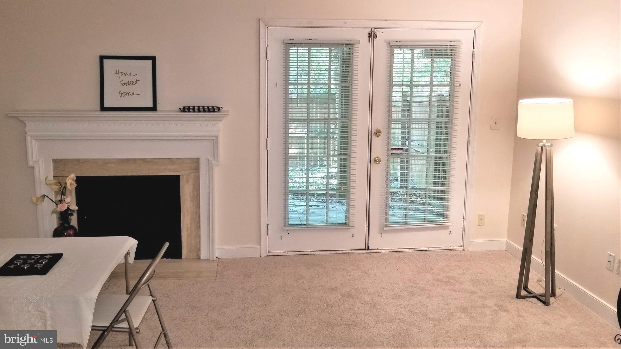 10955 Rocky Mt Way Silver Spring, MD 20902 - Photo 26 of 30 a view of livingroom with furniture and a fireplace