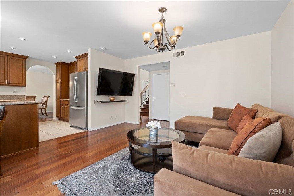 13 West Yale Loop, Unit 2 Irvine, CA 92604 - Photo 16 of 39 a living room with furniture and a flat screen tv