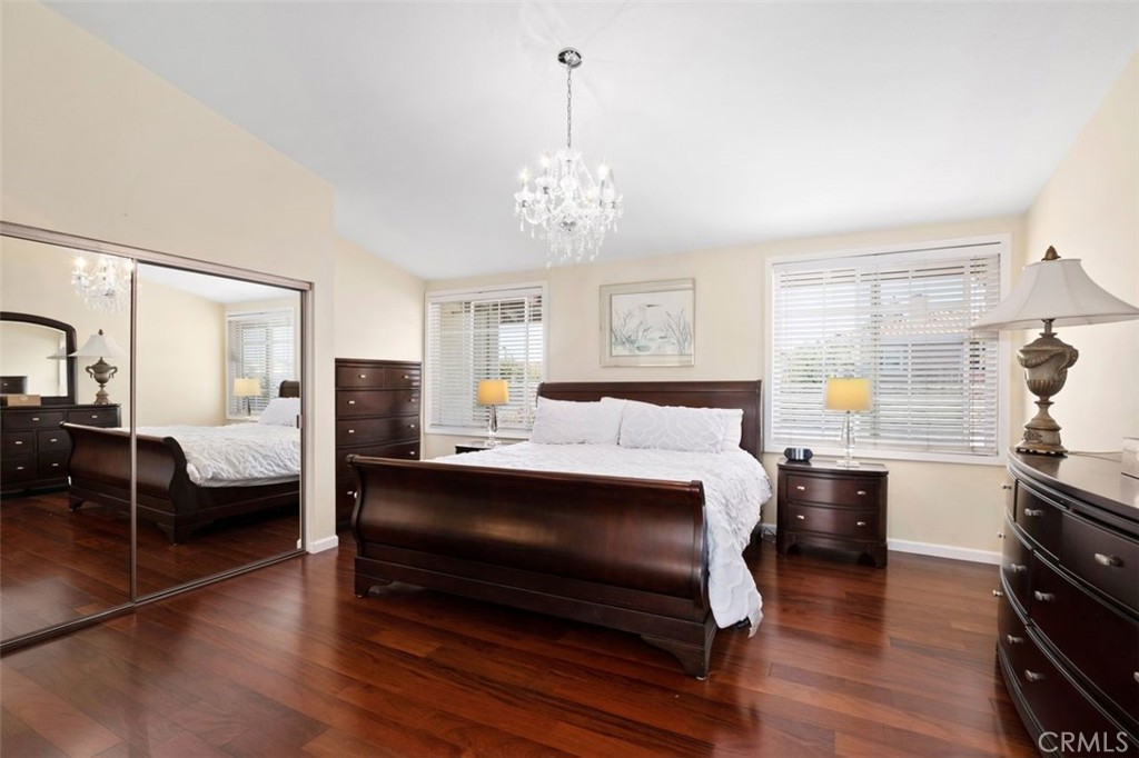 13 West Yale Loop, Unit 2 Irvine, CA 92604 - Photo 25 of 39 a bedroom with a bed and wooden floor