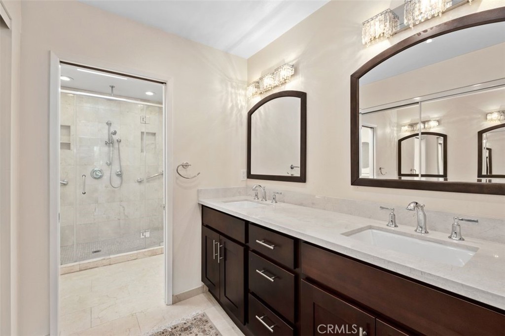 13 West Yale Loop, Unit 2 Irvine, CA 92604 - Photo 27 of 39 a bathroom with a double vanity sink mirror double and shower