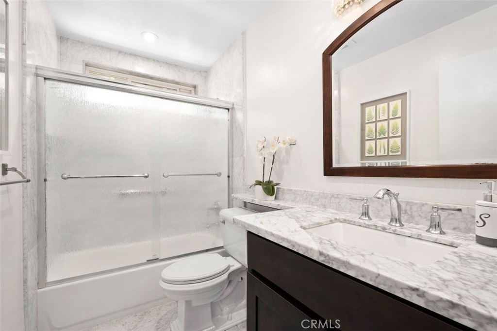 13 West Yale Loop, Unit 2 Irvine, CA 92604 - Photo 31 of 39 a bathroom with a granite countertop sink toilet and shower