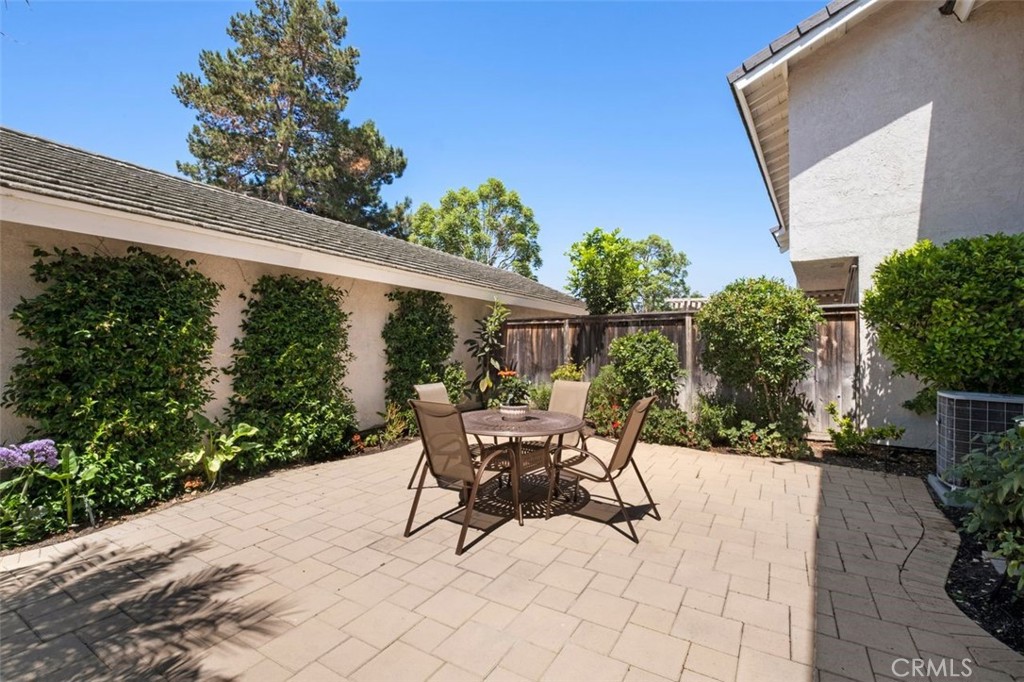 13 West Yale Loop, Unit 2 Irvine, CA 92604 - Photo 34 of 39 a view of a patio with table and chairs and potted plants