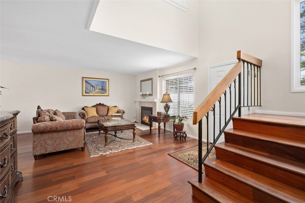 13 West Yale Loop, Unit 2 Irvine, CA 92604 - Photo 8 of 39 a living room with furniture and a wooden floor