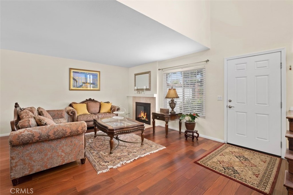 13 West Yale Loop, Unit 2 Irvine, CA 92604 - Photo 9 of 39 a living room with furniture and a fireplace