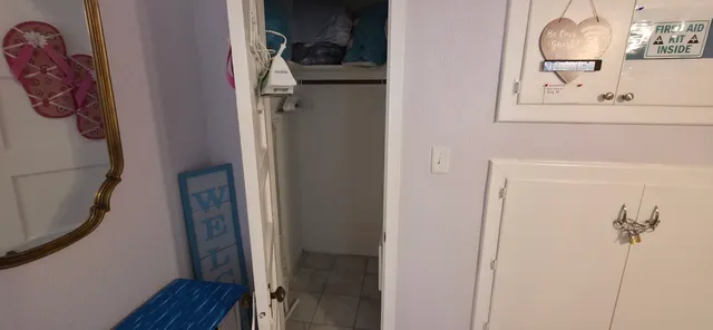 a kitchen with a refrigerator sink and cabinets