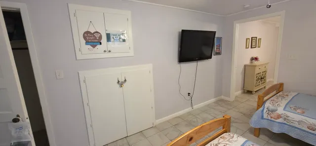 a bedroom with furniture and a window