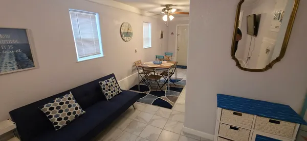 a bedroom with a bed and a mirror