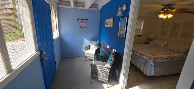 a kitchen with a refrigerator sink and white cabinets
