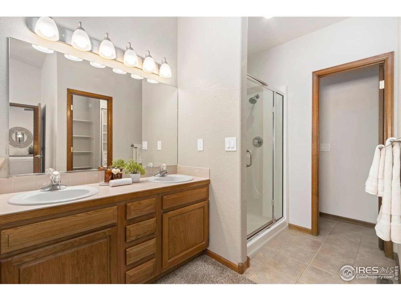 1531 West Swallow Road, Unit 28 Fort Collins, CO 80526 - Photo 13 of 23 a bathroom with a sink vanity and a mirror