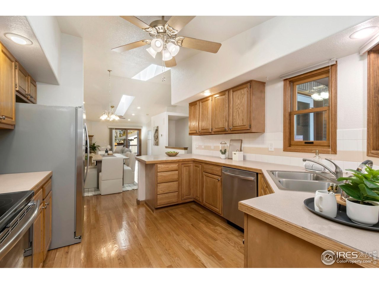 1531 West Swallow Road, Unit 28 Fort Collins, CO 80526 - Photo 9 of 23 a kitchen with a sink appliances and cabinets