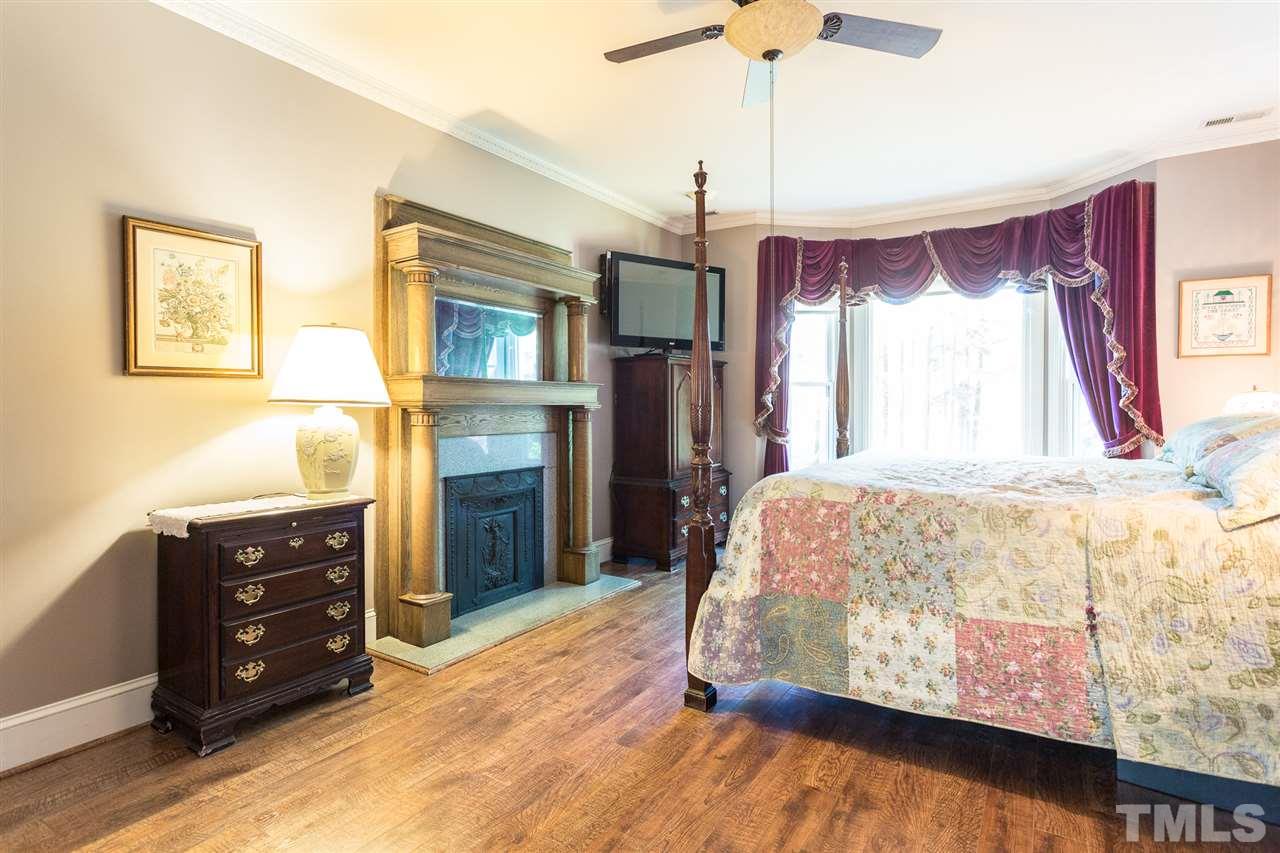 8329 Glory Road Zebulon, NC 27597 - Photo 18 of 30 This large Master Bedroom (20.4x13) has another beautiful bay window overlooking the front yard. This Master has its own Master Bath and his/her walk-in closets. There is a private back hallway that leads to the Game Room, Gym and Laundry from this room