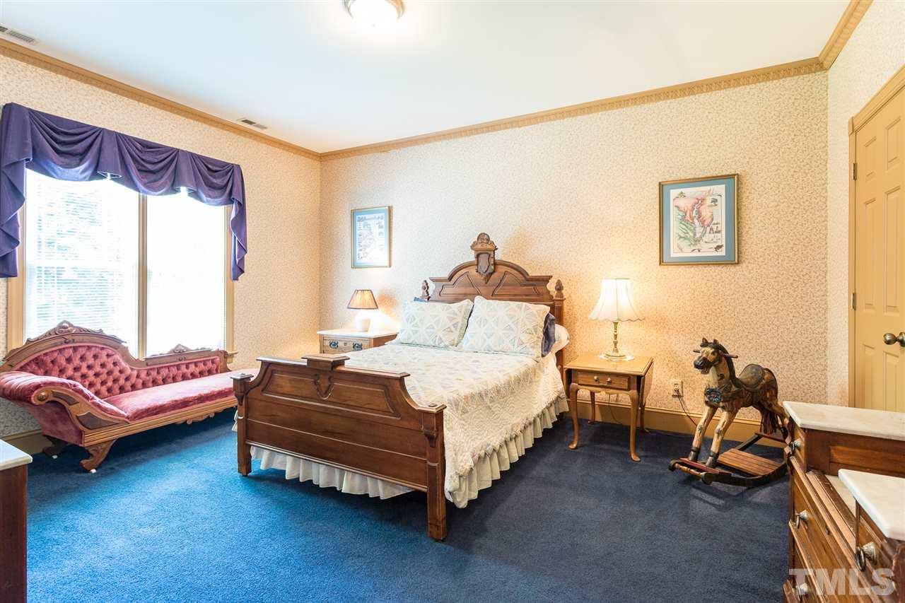 8329 Glory Road Zebulon, NC 27597 - Photo 21 of 30 This bedroom is 15.7x13 and has a large window overlooking the back yard. Large Walk-In Closet.