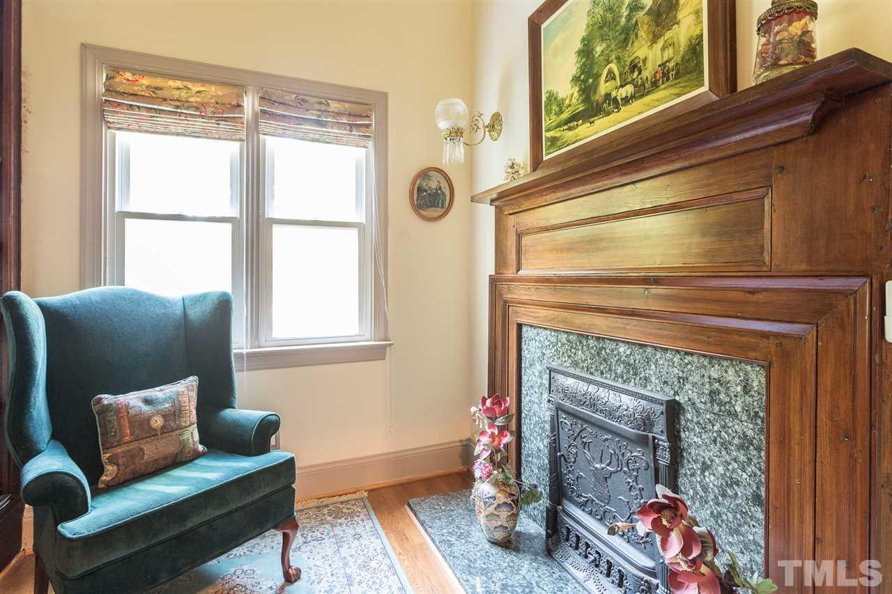 8329 Glory Road Zebulon, NC 27597 - Photo 23 of 30 It may be small at 8x8 but it packs a big statement as it is located in the 'Tower'. With vaulted ceiling, tall windows, heavily adorned wood mantle & 'built-in' bookcases it makes this a BIG little space. Perfect cozy study nook to enjoy working/reading!