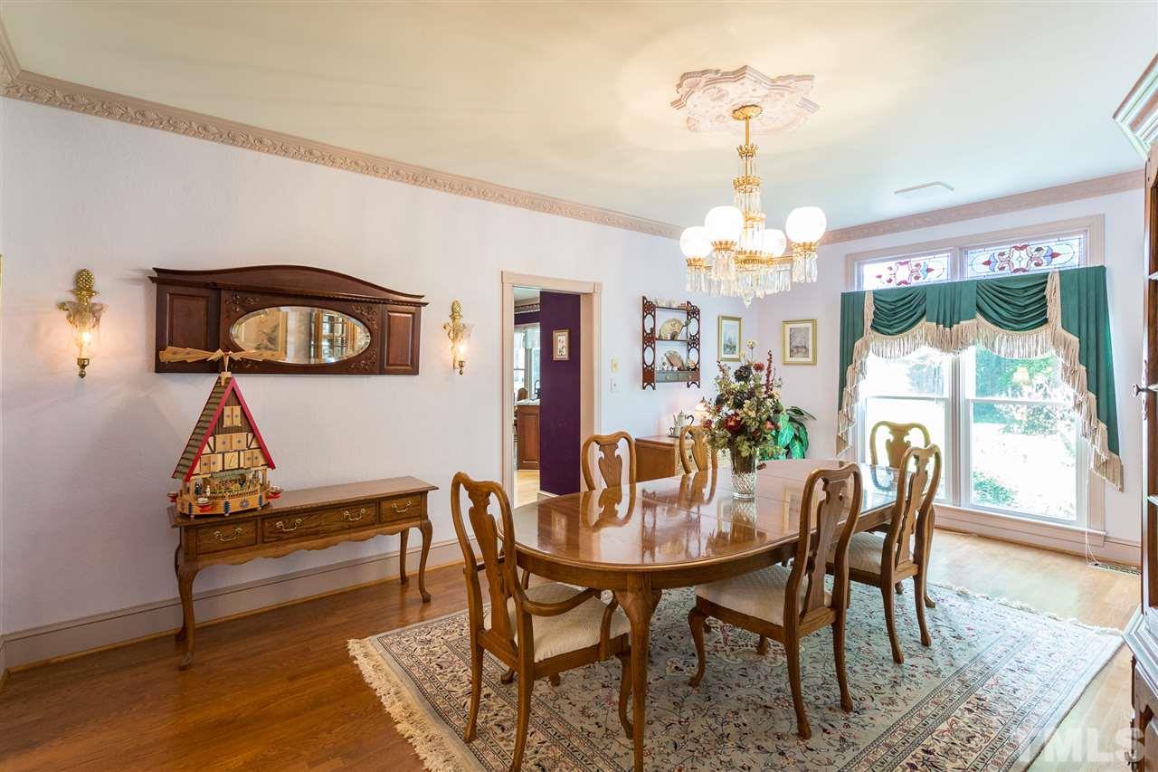 8329 Glory Road Zebulon, NC 27597 - Photo 6 of 30 Newly refinished Hardwood Floors in this bright Dining Room. This table could easily sit 10-12 and still have plenty of space for China Cabinet/Hutch.