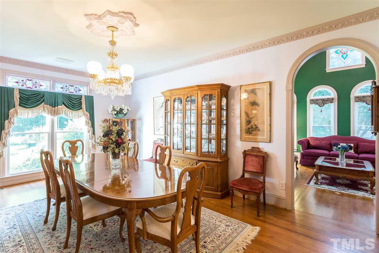 8329 Glory Road Zebulon, NC 27597 - Photo 7 of 30 Hardwood Floors and Floor to ceiling windows make this Dining Room timeless!