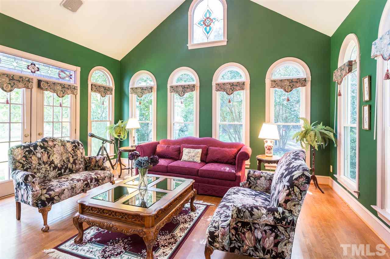 8329 Glory Road Zebulon, NC 27597 - Photo 8 of 30 Huge Sunroom (17.2' x 15.6') with beautiful floor to ceiling windows! This space is excellent for entertaining and has french doors that lead to a brick staircase to the yard. Great overflow for parties!