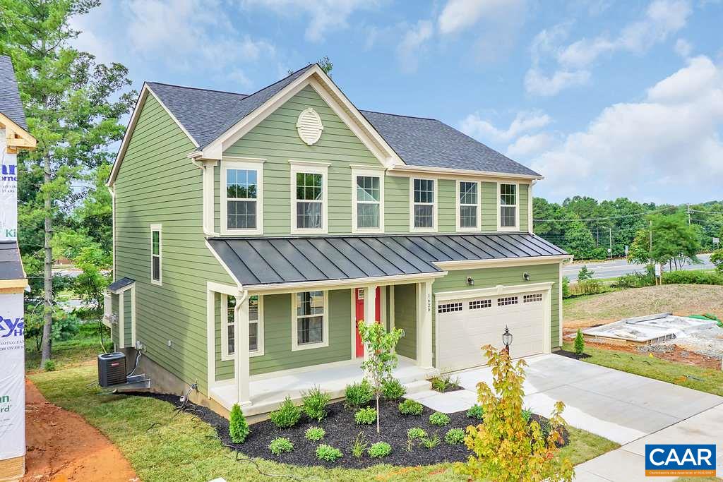 1634 Fowler Ridge Court Charlottesville, VA 22901 - Photo 1 of 28 a front view of a house with a yard