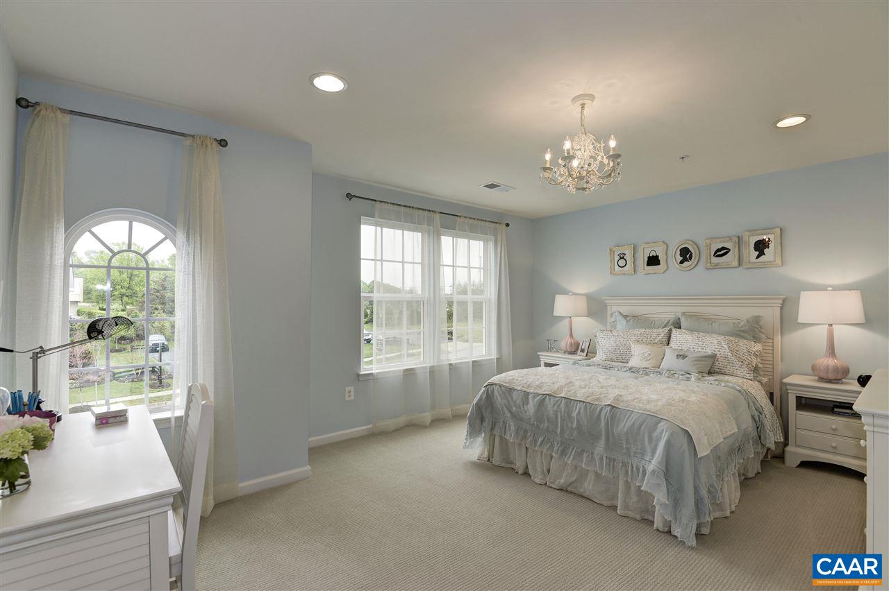 1634 Fowler Ridge Court Charlottesville, VA 22901 - Photo 13 of 28 a spacious bedroom with a bed and a large window