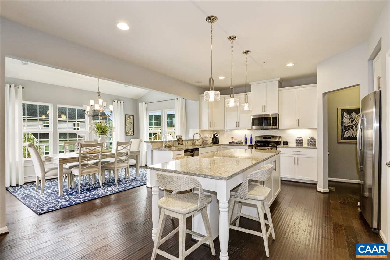 1634 Fowler Ridge Court Charlottesville, VA 22901 - Photo 3 of 28 a large kitchen with a table and chairs