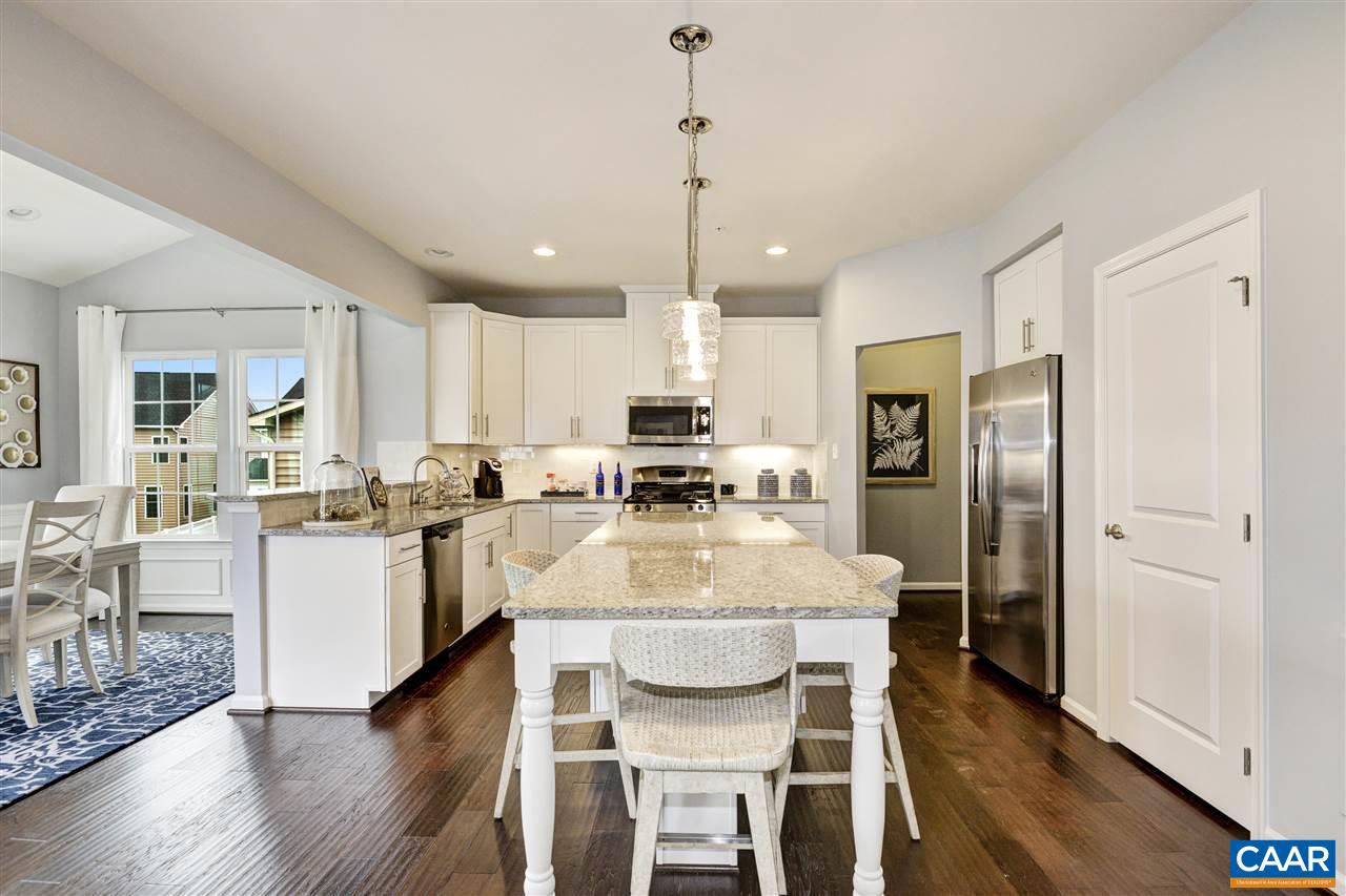 1634 Fowler Ridge Court Charlottesville, VA 22901 - Photo 4 of 28 a large kitchen with a table and chairs