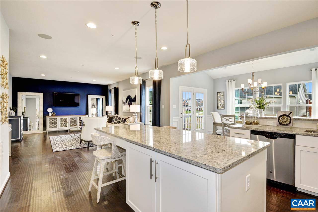 1634 Fowler Ridge Court Charlottesville, VA 22901 - Photo 5 of 28 a large kitchen with kitchen island a large island in it