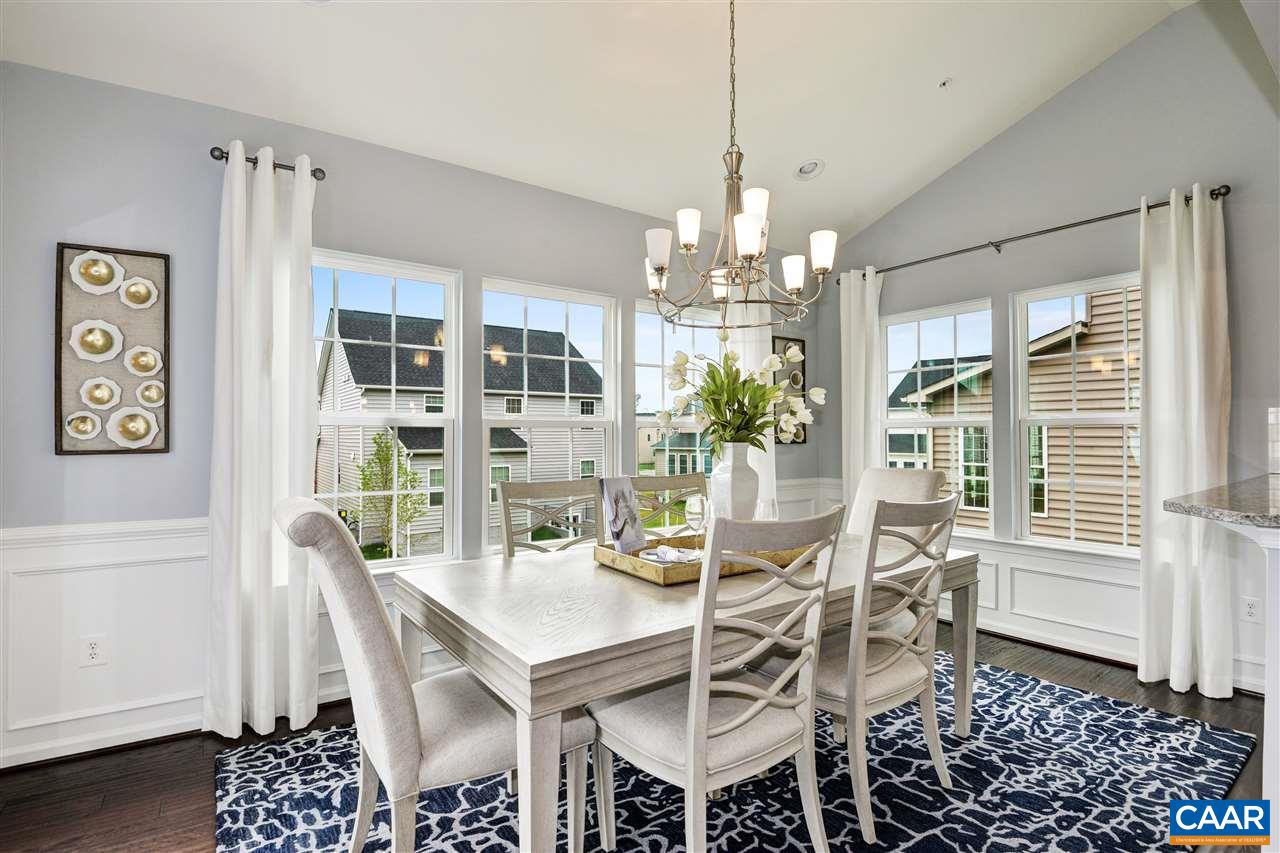 1634 Fowler Ridge Court Charlottesville, VA 22901 - Photo 6 of 28 a view of a dining room with furniture wooden floor and chandelier