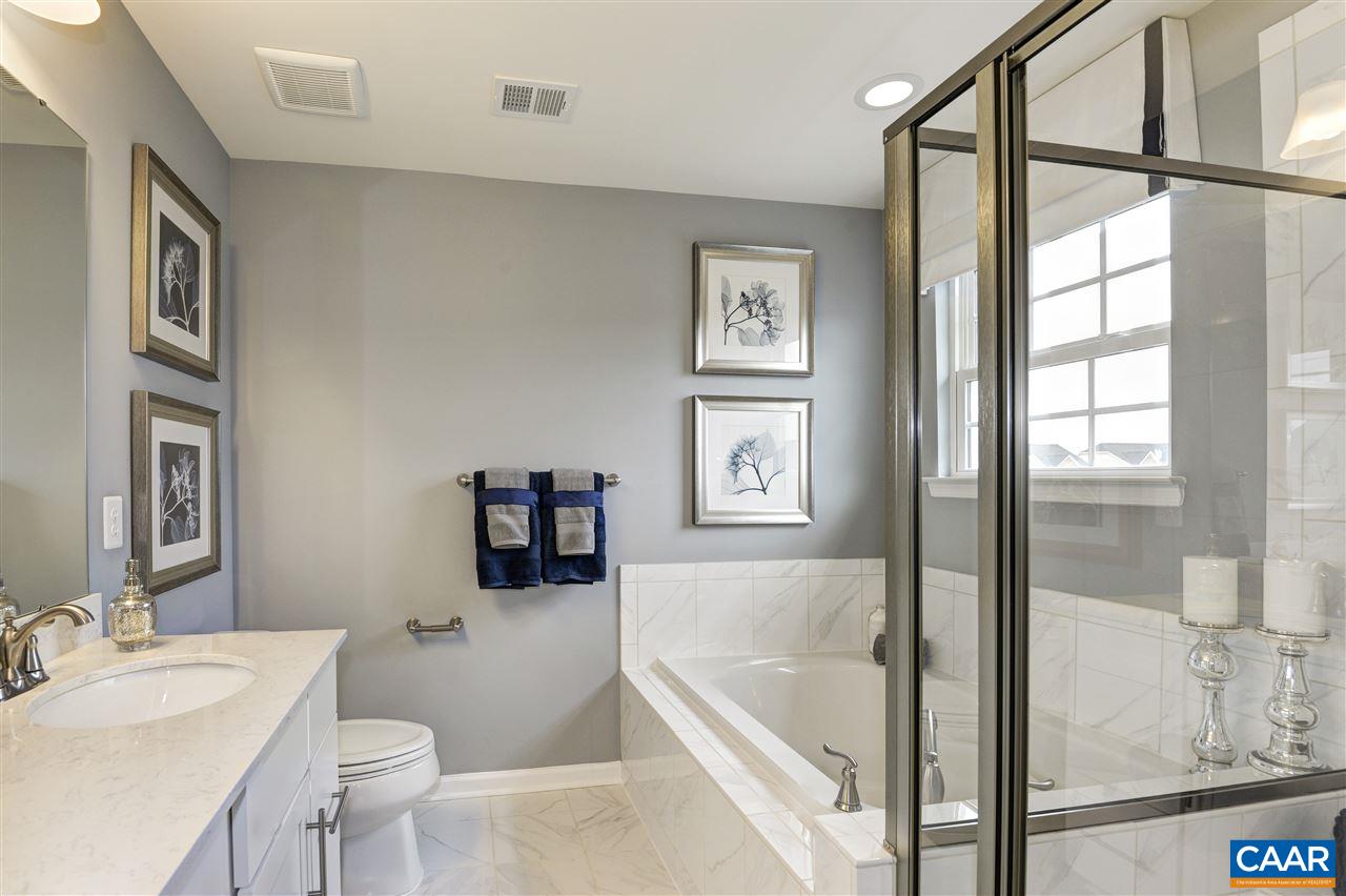 1634 Fowler Ridge Court Charlottesville, VA 22901 - Photo 10 of 28 a bath room with a toilet a bath tub and a shower