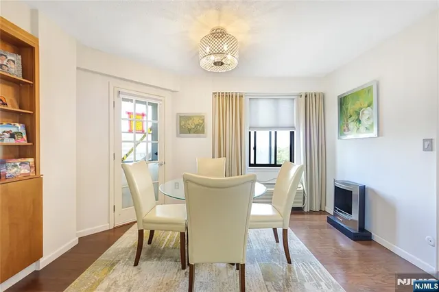 a view of a dining room with furniture and window