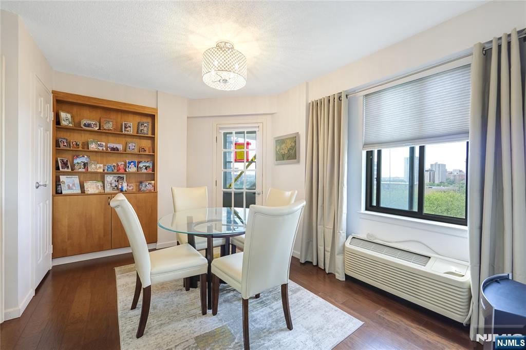 307 Prospect Avenue, Unit 9A Hackensack, NJ 07601 - Photo 13 of 29 a view of a dining room with furniture and wooden floor