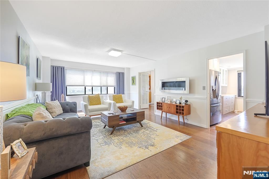 307 Prospect Avenue, Unit 9A Hackensack, NJ 07601 - Photo 5 of 29 a living room with furniture and a wooden floor