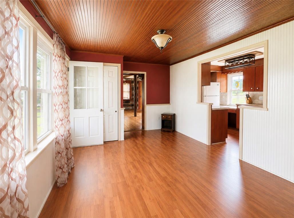7281 Decatur Street New Tripoli, PA 18066 - Photo 8 of 27 Hardwood floors and a beadboard ceiling define this inviting space.
