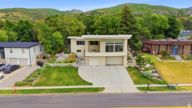 1389 Millbrook Way Bountiful, UT 84010 - Photo 6 of 74 Modern architectural residence featuring a neutral facade and multi-level design