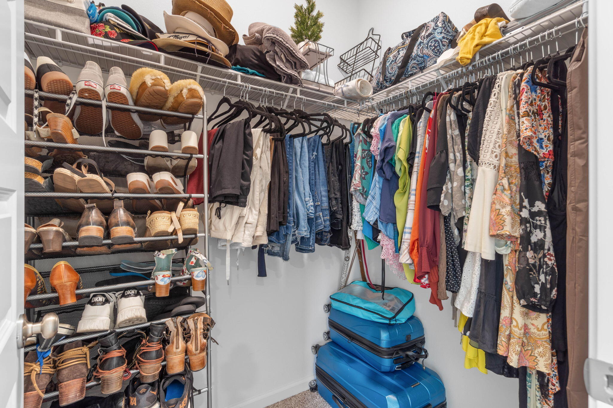 38 Silverthorn Street Freeport, FL 32439 - Photo 24 of 42 a view of walk in closet with clothes and shoes