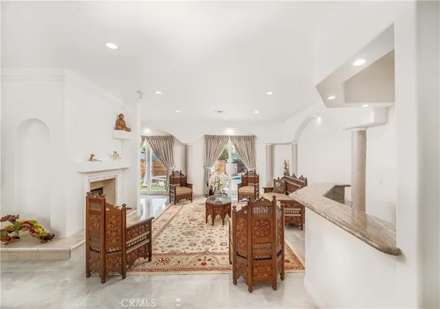 a living room with furniture and a rug