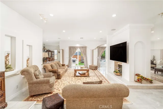 a living room with furniture and a table