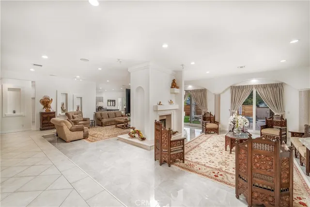 a kitchen with stainless steel appliances granite countertop a sink and a refrigerator