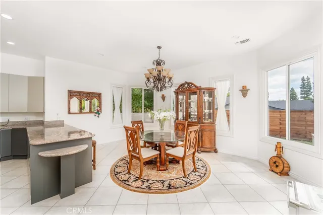 a view of walk in closet with clothes