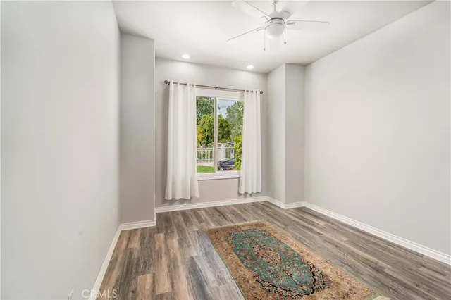 a building view with a garden and trees