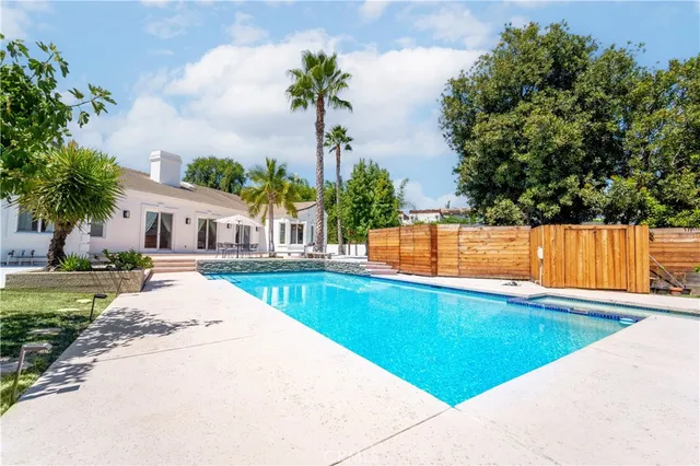 a living room with furniture gym equipment and a fireplace