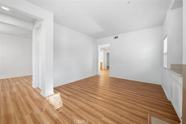 a view of a room with wooden floor and staircase