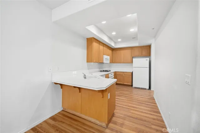 a bathroom with a sink a mirror and a shower