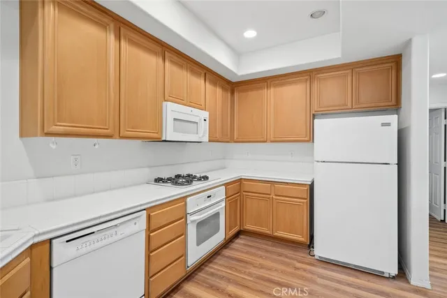 a kitchen with stainless steel appliances granite countertop a refrigerator sink and cabinets