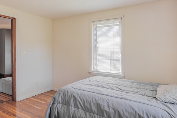 31 Bickford Road Braintree, MA 02184 - Photo 11 of 28 a bedroom with a bed and a window