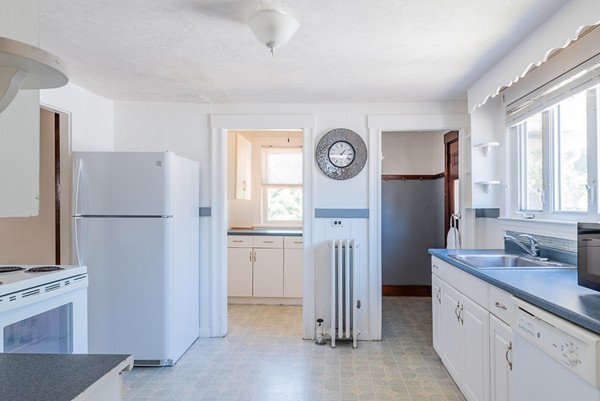31 Bickford Road Braintree, MA 02184 - Photo 16 of 28 a kitchen with a refrigerator and a stove