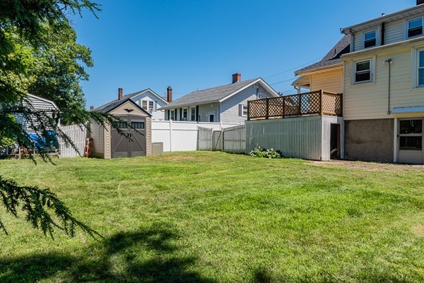 31 Bickford Road Braintree, MA 02184 - Photo 27 of 28 a front view of a house with a yard and garage