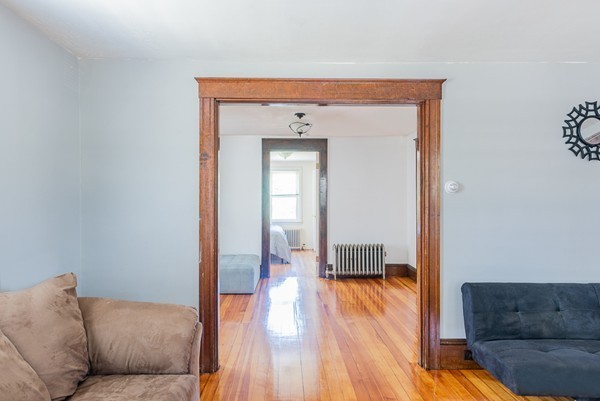 31 Bickford Road Braintree, MA 02184 - Photo 7 of 28 a living room with furniture and a wooden floor