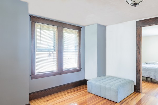 31 Bickford Road Braintree, MA 02184 - Photo 8 of 28 a bedroom with a bed and wooden floor
