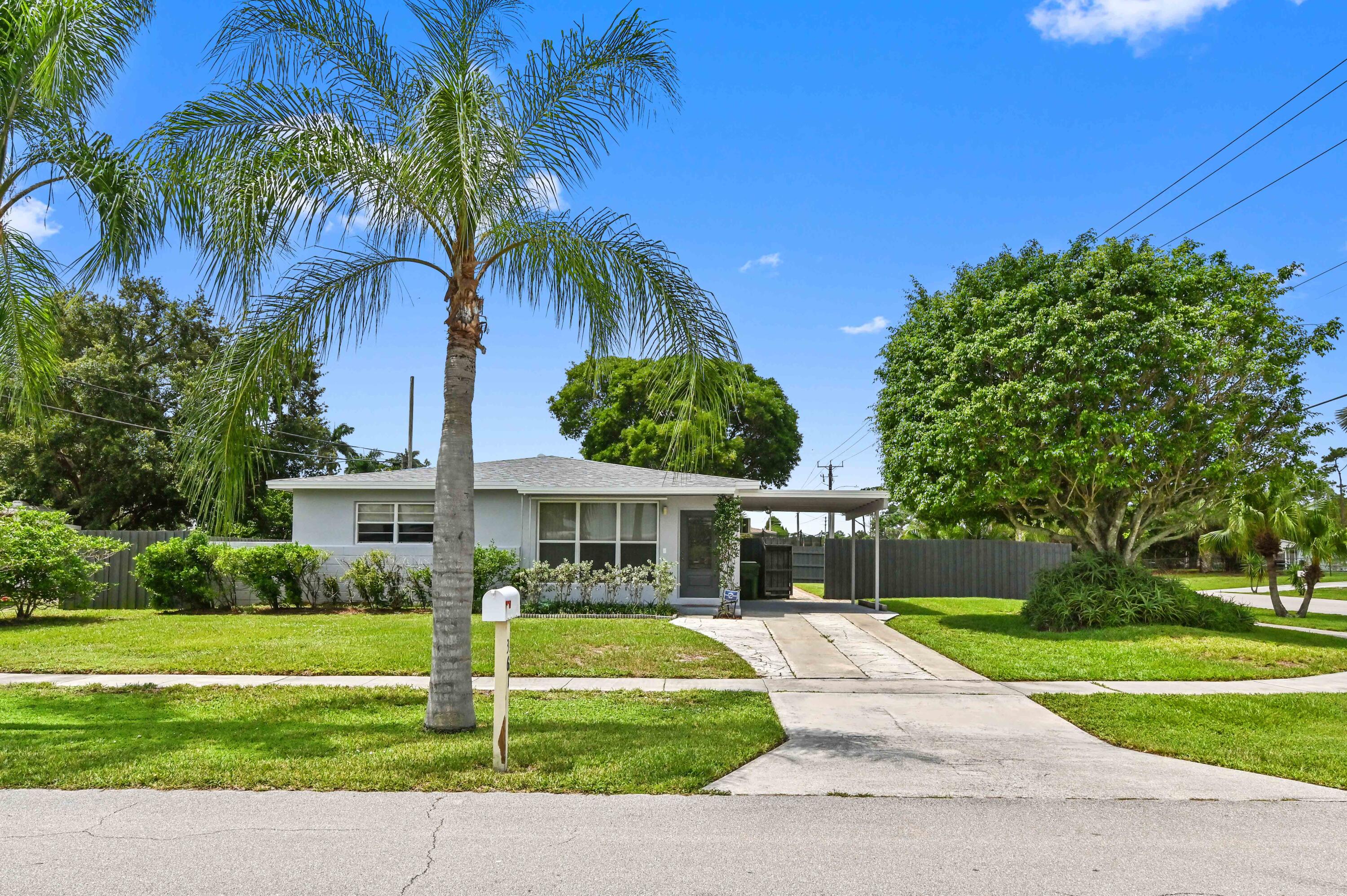 361 East Lake Road Palm Springs, FL 33461 - Photo 1 of 35 01 front 01