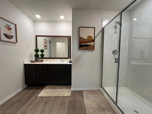 a bedroom with a bed and a desk